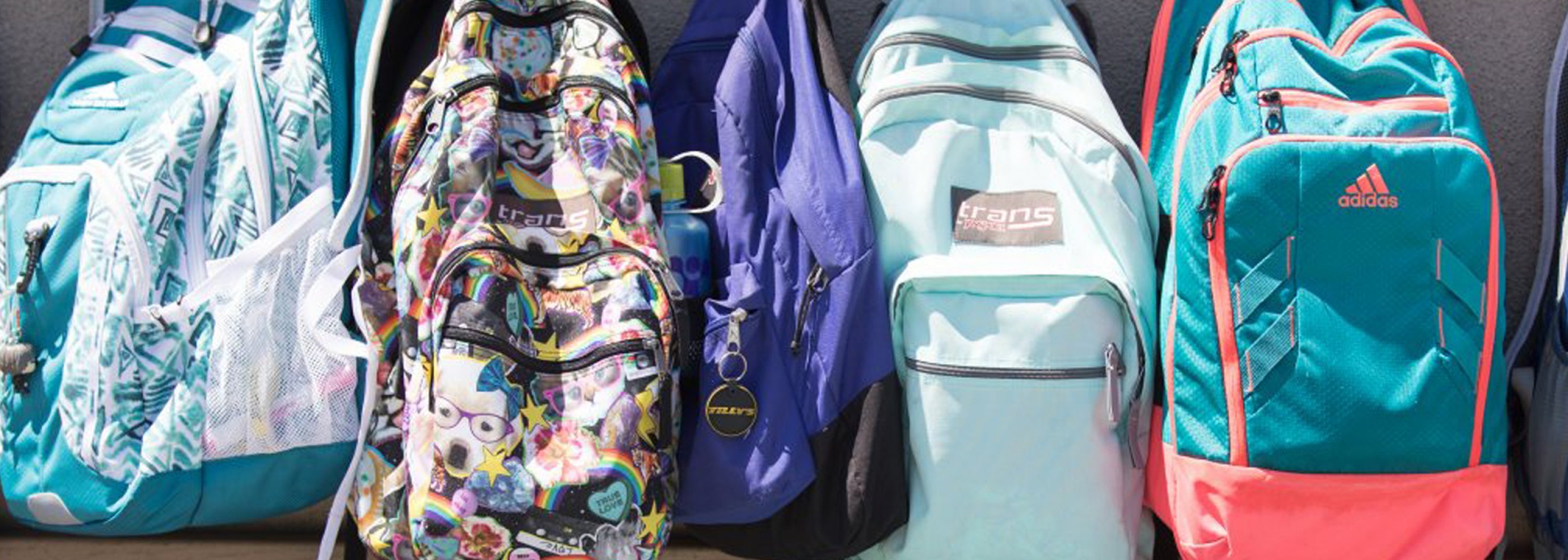 lined up backpacks